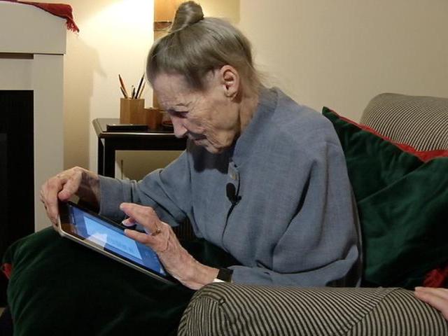 older woman using ipad